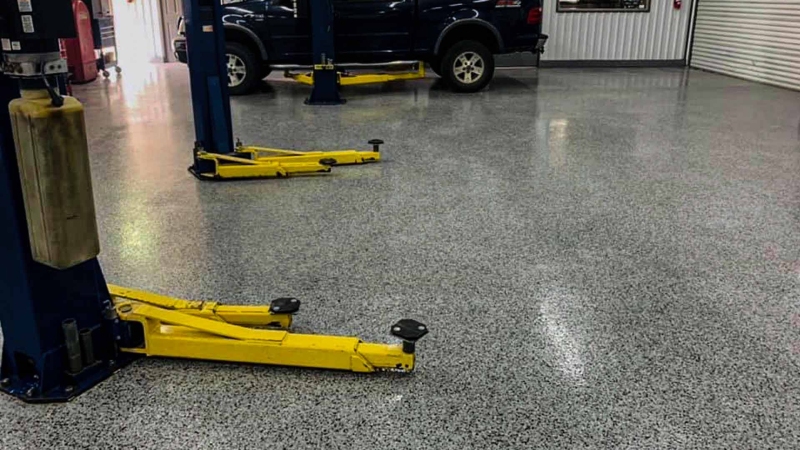Garage polyaspartic flake flooring on a local mechanic shop.