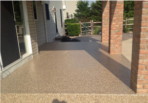 Patio flake flooring with polyurea sealing.