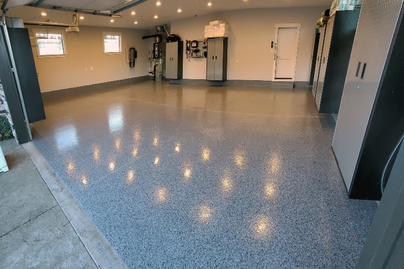 Flake midnight black epoxy flooring for basement-like facility
