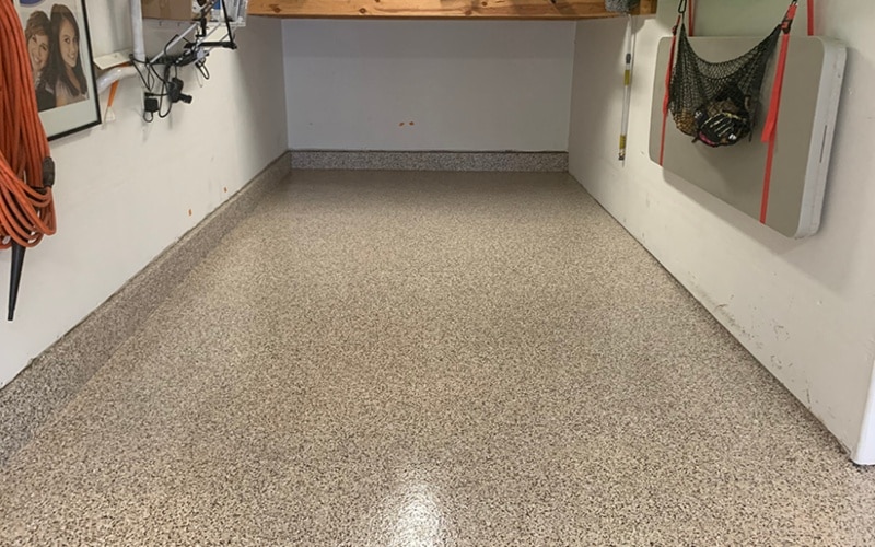 Basement with flake saddle tan epoxy floor finish
