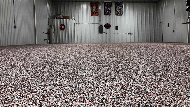 Warehouse with flake flooring and polyurea sealer.