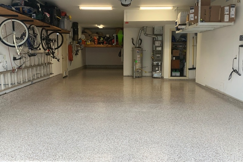 Flake saddle tan epoxy-finished floor for cyclists garage