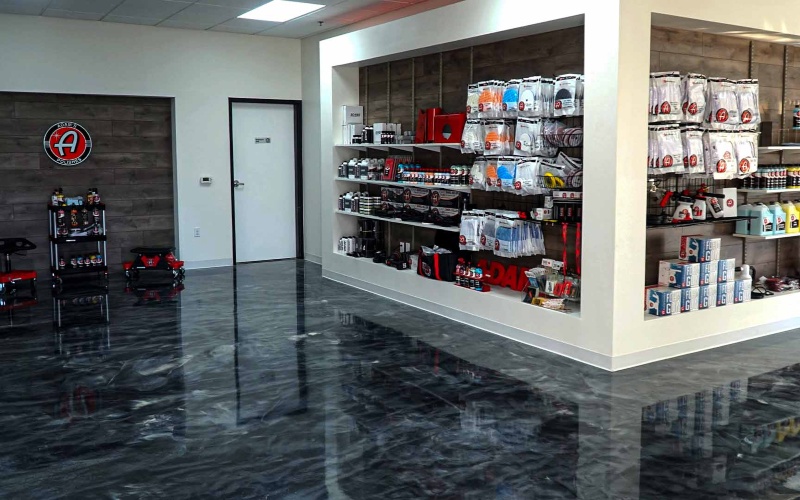 Retail store with silver epoxy floor displaying several random products